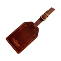 Handmade Leather Luggage Tag in Cognac - closed front view with logo