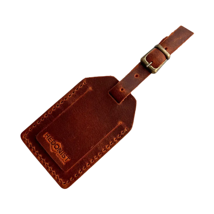 Handmade Leather Luggage Tag in Cognac - closed front view with logo