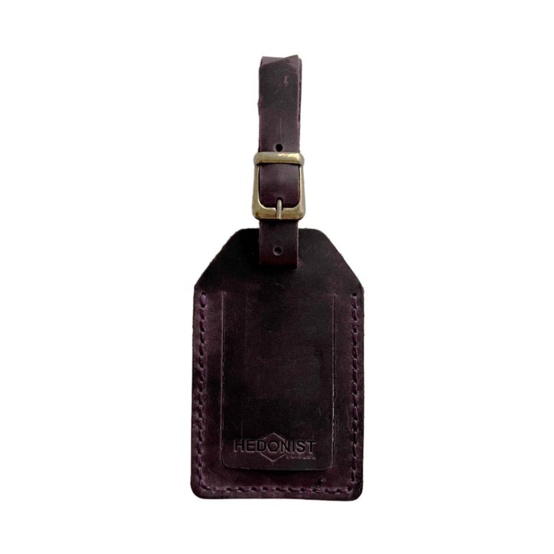 Handmade Leather Luggage Tag in Plum - closed front view with logo