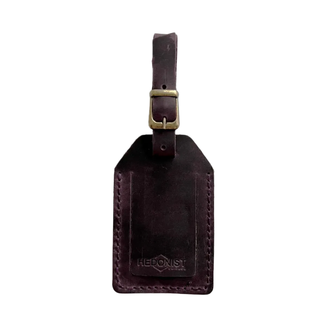 Handmade Leather Luggage Tag in Plum - closed front view with logo