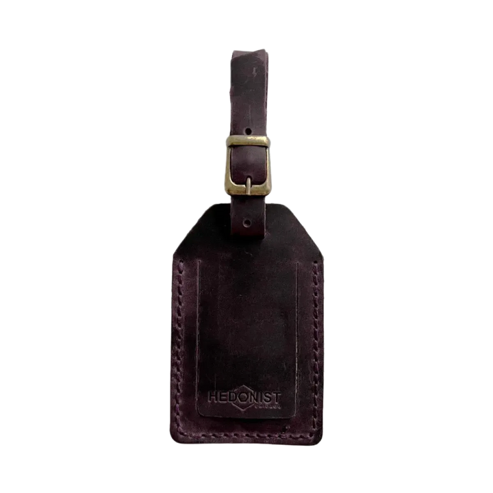 Handmade Leather Luggage Tag in Plum - closed front view with logo