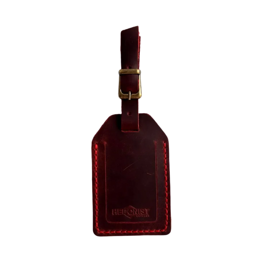 Handmade Leather Luggage Tag in Red - closed front view with logo