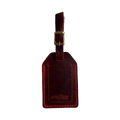 Handmade Leather Luggage Tag in Red - closed front view with logo