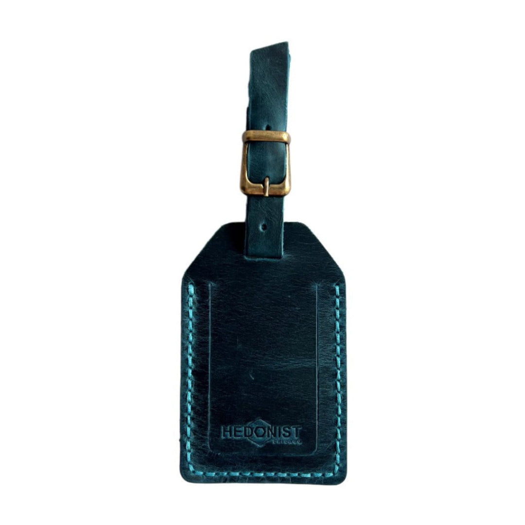 Handmade Leather Luggage Tag in Teal - closed front view with logo
