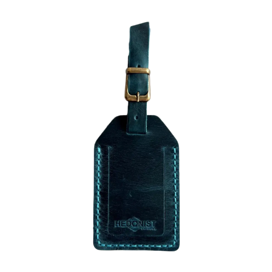Handmade Leather Luggage Tag in Teal - closed front view with logo
