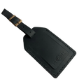 Black full-grain leather luggage tag with brass buckle strap, embossed Hedonist Chicago logo in the lower right corner, shown on a white background.