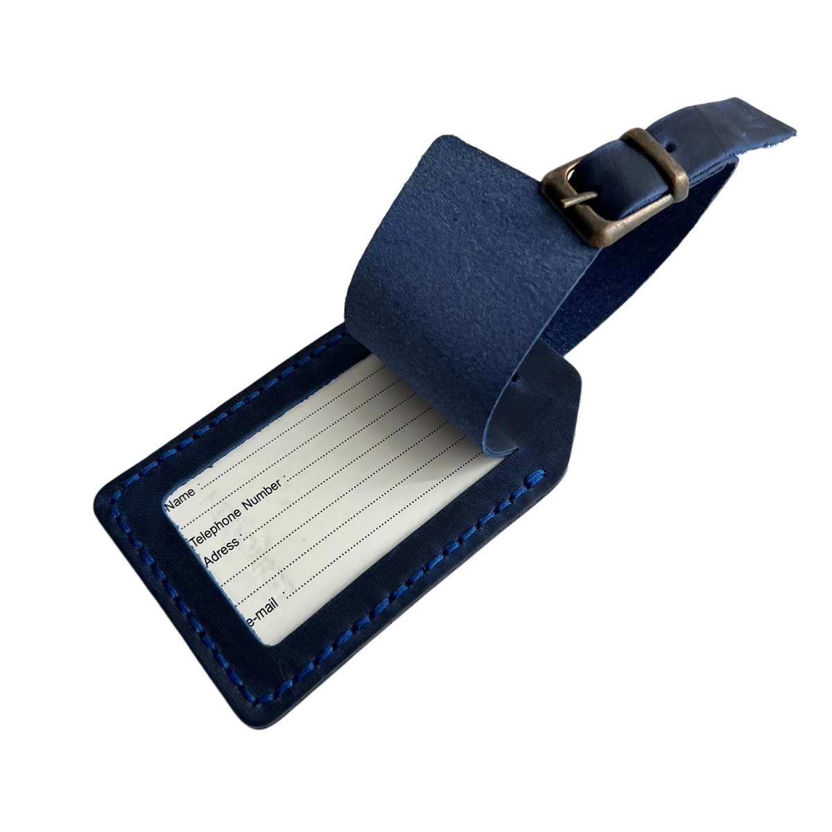 Navy blue full-grain leather luggage tag with matching adjustable strap and brass buckle, shown open with a printable ID insert card.