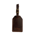 Brown full-grain leather luggage tag with brass buckle and strap, embossed Hedonist Chicago logo near the bottom, shown on a light gray background.