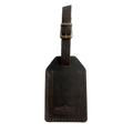 Dark brown full-grain leather luggage tag with matching leather strap and brass buckle, embossed Hedonist Chicago logo on the front, shown on a light gray background.