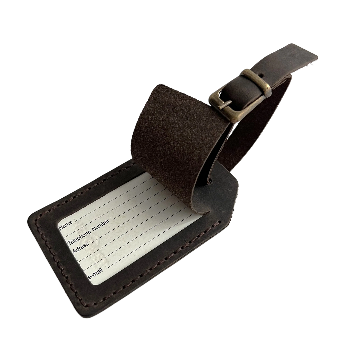 Dark brown full-grain leather luggage tag with matching adjustable strap and brass buckle, shown on a white background.