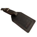 Dark brown full-grain leather luggage tag with matching leather strap and brass buckle, embossed Hedonist Chicago logo on the front, shown on a white background.