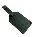Green full-grain leather luggage tag with matching leather strap and brass buckle, visible contrast stitching, embossed Hedonist Chicago logo on the front.