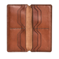 Handmade light mahogany leather card holder, 8 card slots, open showing cards