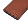 Handmade light mahogany leather card holder, styled angled view