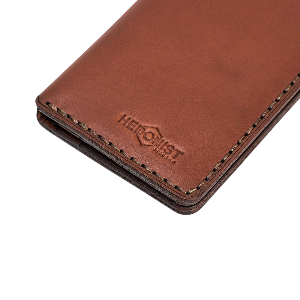Handmade light mahogany leather card holder, styled angled view