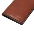 Handmade light mahogany leather card holder, styled angled view