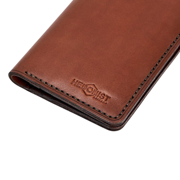Handmade light mahogany leather card holder, styled angled view