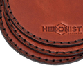 Hedonist Chicago leather coasters in Light Mahogany Mahogany, clean edge, full grain leather, angled view