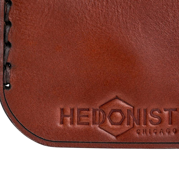 Hedonist Chicago mahogany key chain in mahogany, slim profile, full grain leather, flat lay view