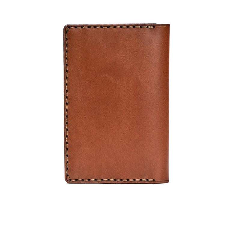 Hedonist Chicago light mahogany passport case in light mahogany, travel cover, full grain leather, angled view
