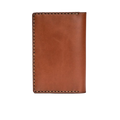 Hedonist Chicago light mahogany passport case in light mahogany, travel cover, full grain leather, angled view