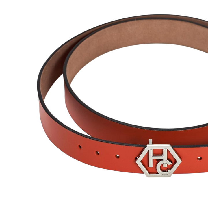 Hedonist Chicago signature buckle close-up on women's seamless edge leather belt - orange-red - close-up view (1.3")