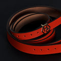 Side view on women's seamless edge leather belt - orange-red - Hedonist Chicago - close-up view (1")