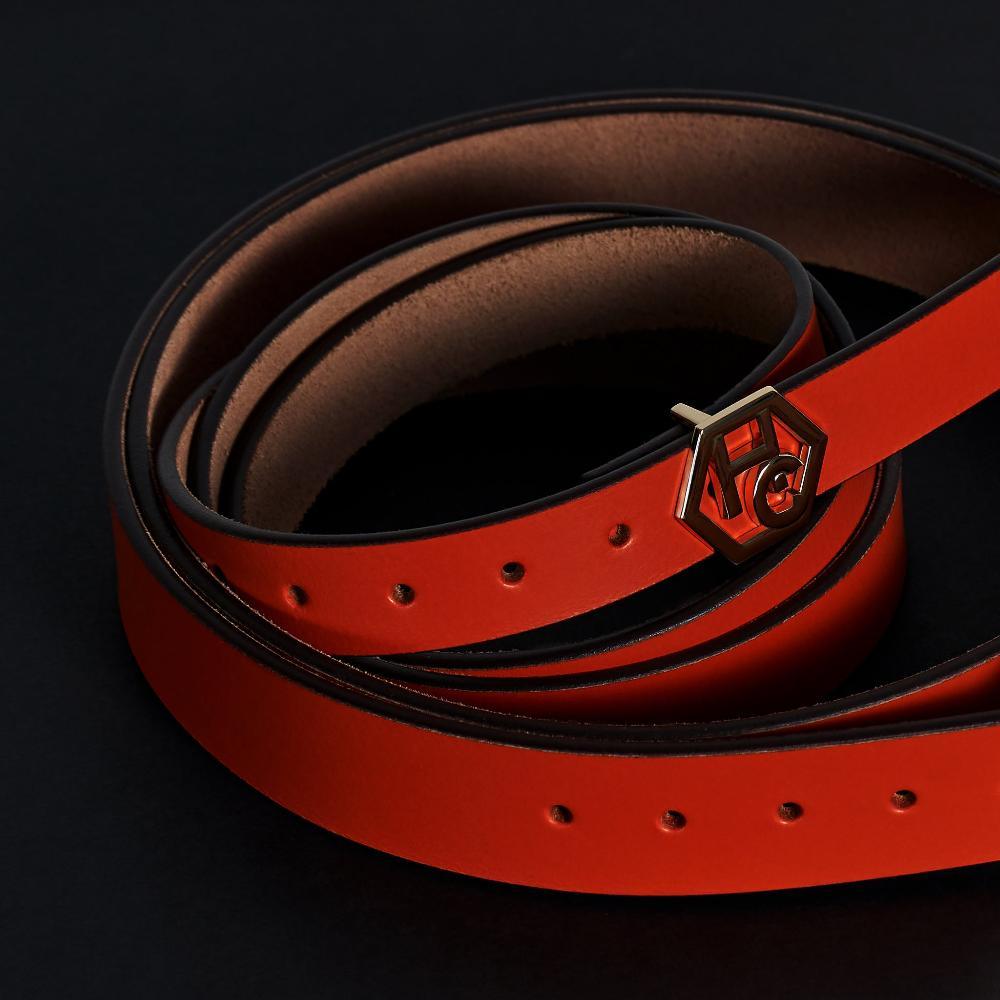 Side view on women's seamless edge leather belt - orange-red - Hedonist Chicago - close-up view (1")