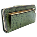 Detail of zip coin pocket on green croc-embossed leather long wallet for women with gold zipper