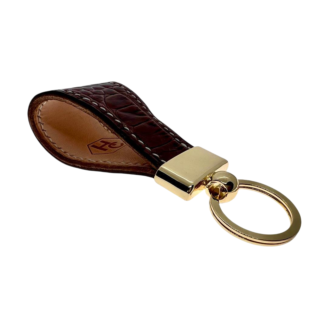 Hedonist Chicago brown key chain in brown, slim profile, full grain leather, angled view