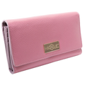 Pink leather trifold wallet for women closed, gold-tone Hedonist Chicago plaque on front