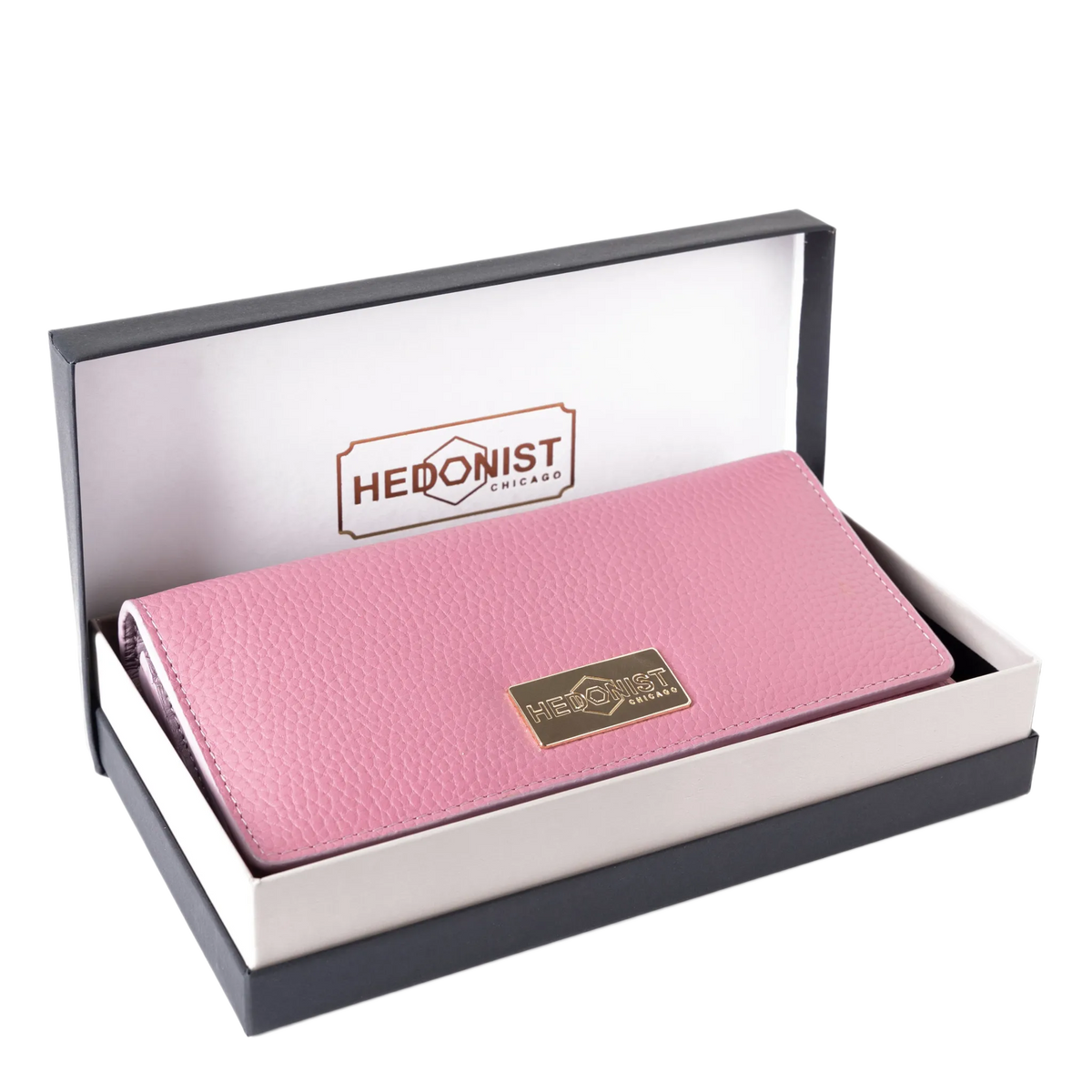 Pink leather trifold wallet presented in Hedonist Chicago branded gift box