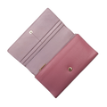 Pink leather trifold wallet open showing card slots and gold-tone snap closure