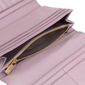 Close-up of pink leather trifold wallet showing card slots and gold zipper pull engraved with HC logo