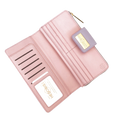 Pink pebbled leather travel wallet open showing ID window and card slots