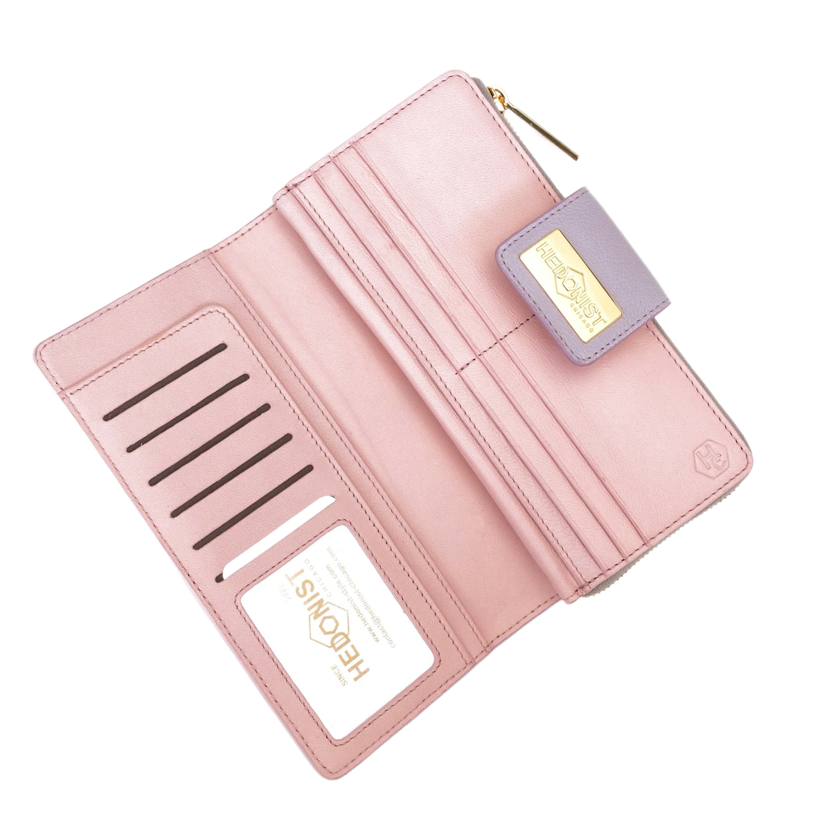 Pink pebbled leather travel wallet open showing ID window and card slots