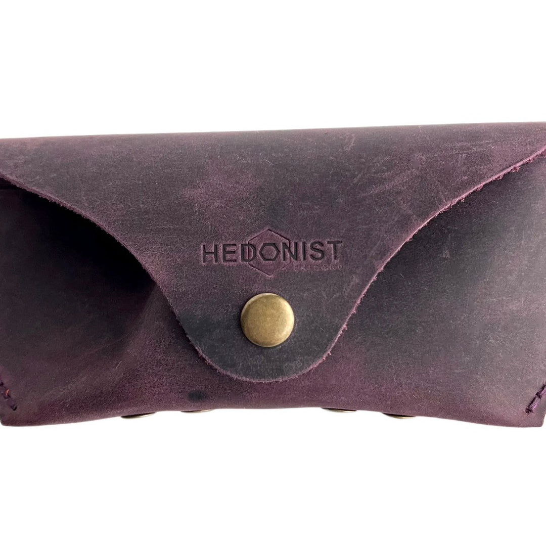 Soft Leather Eye Glasses Case in Plum, closed, front view with embossed Hedonist logo and snap closure