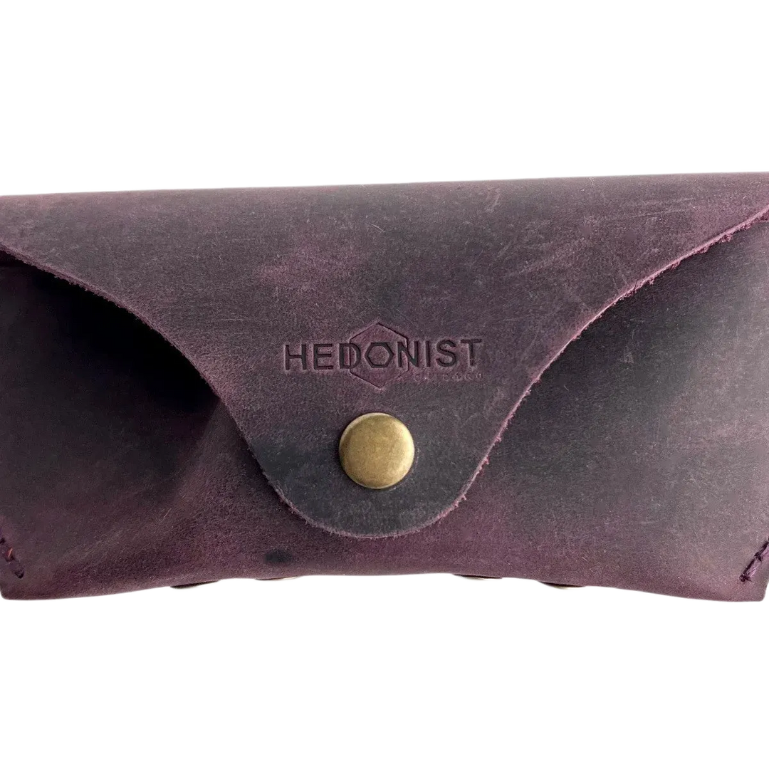 Soft Leather Eye Glasses Case in Plum, closed, front view with embossed Hedonist logo and snap closure