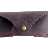 Soft Leather Eye Glasses Case in Plum, closed, front view with embossed Hedonist logo and snap closure