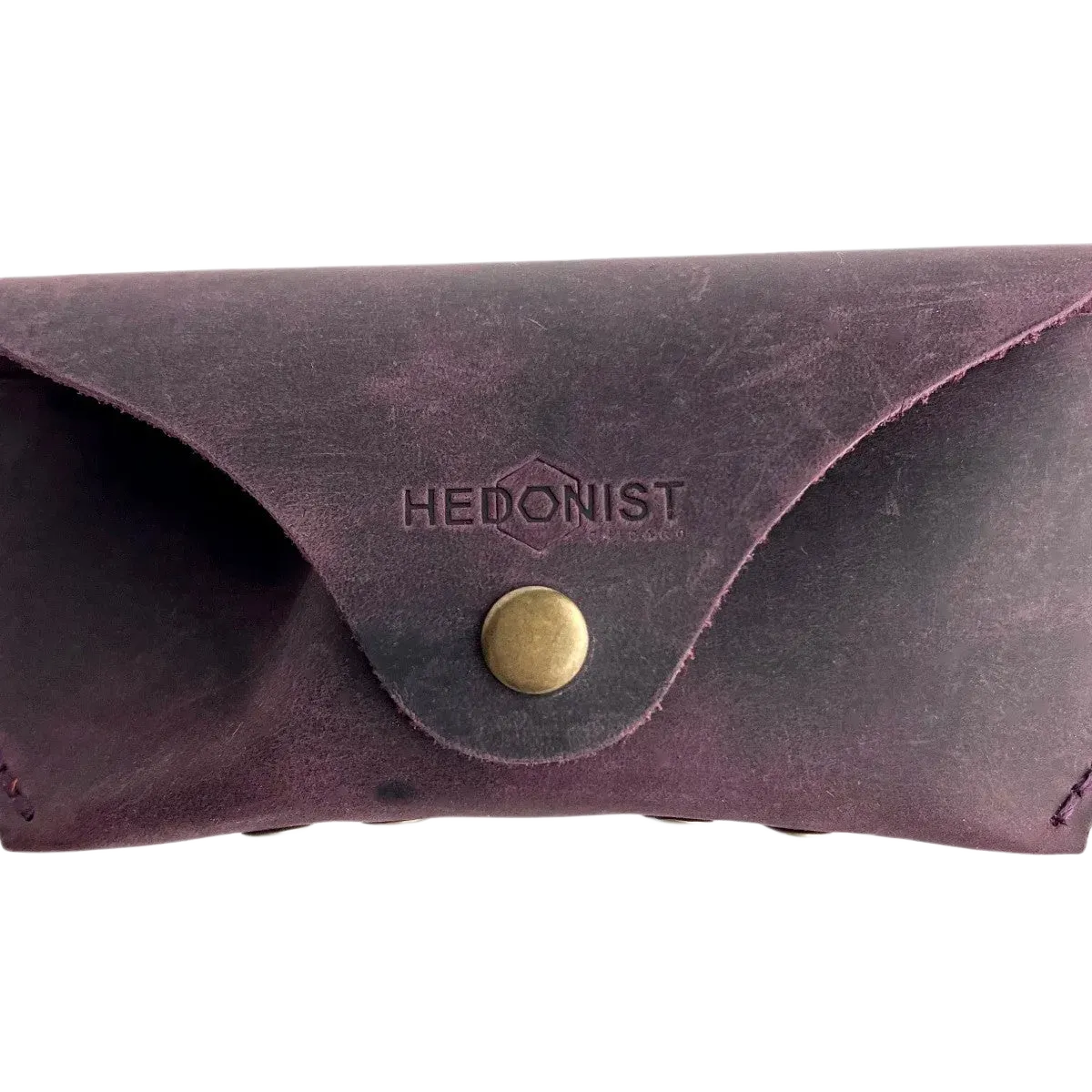 Soft Leather Eye Glasses Case in Plum, closed, front view with embossed Hedonist logo and snap closure