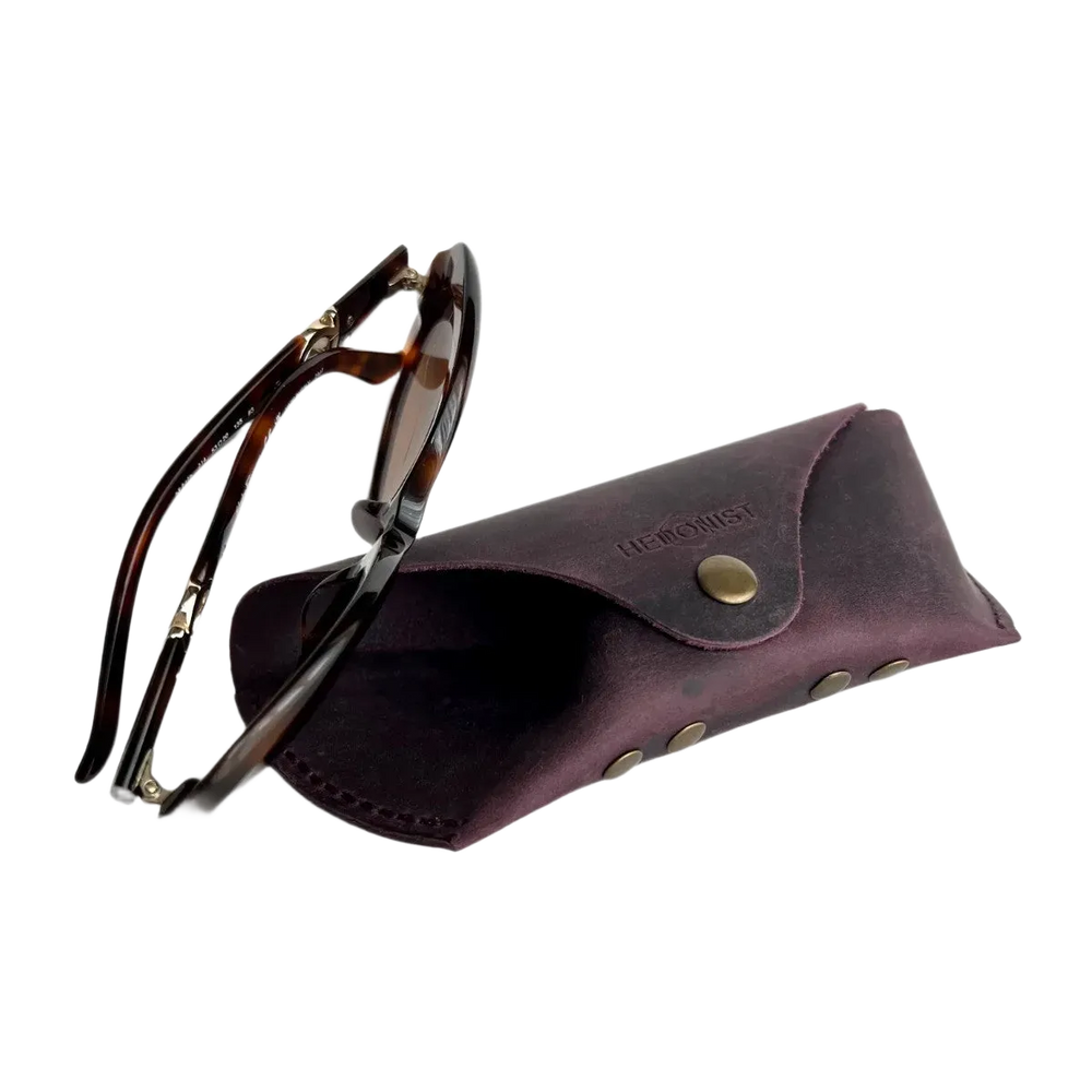 Soft Leather Eye Glasses Case in Plum with tortoiseshell sunglasses beside it