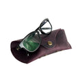 Soft Leather Eye Glasses Case in Plum with tinted-lens eyeglasses resting on top