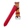 Red leather Apple Watch band, texture and buckle detail close-up