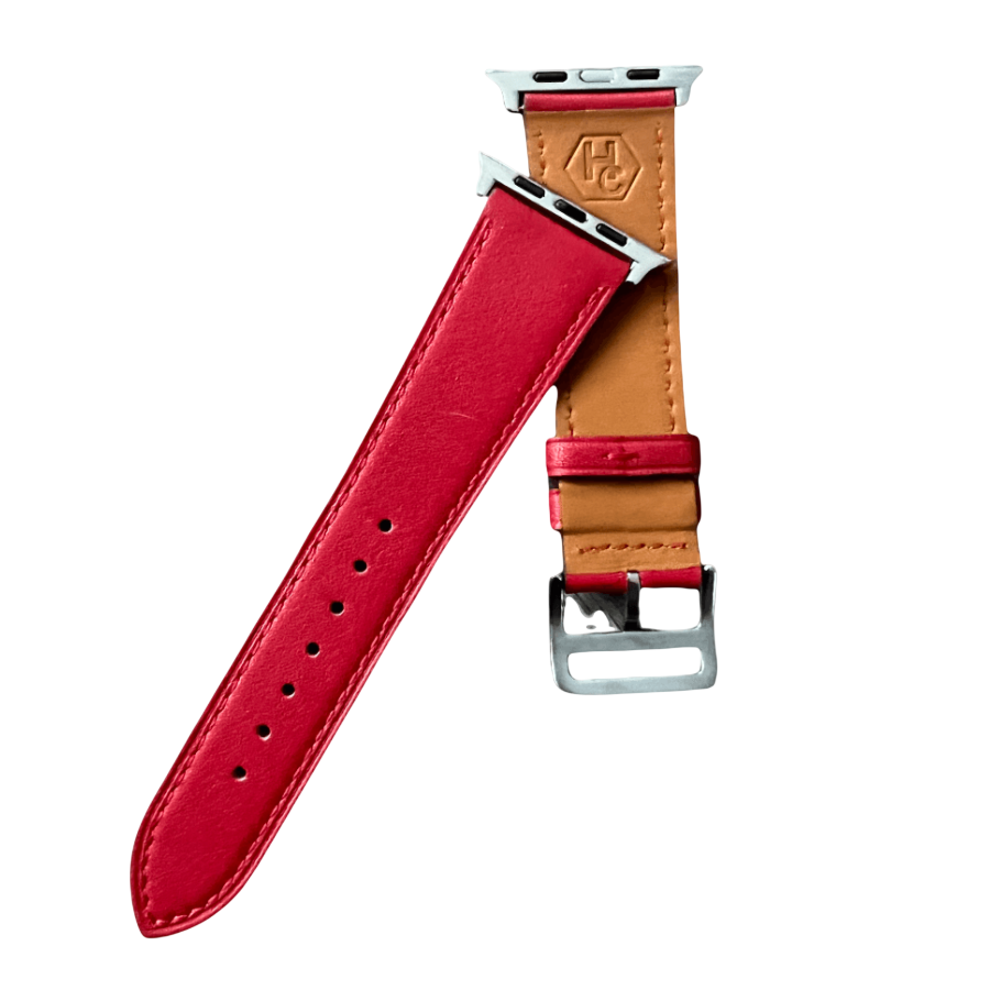 Red leather Apple Watch band, texture and buckle detail close-up