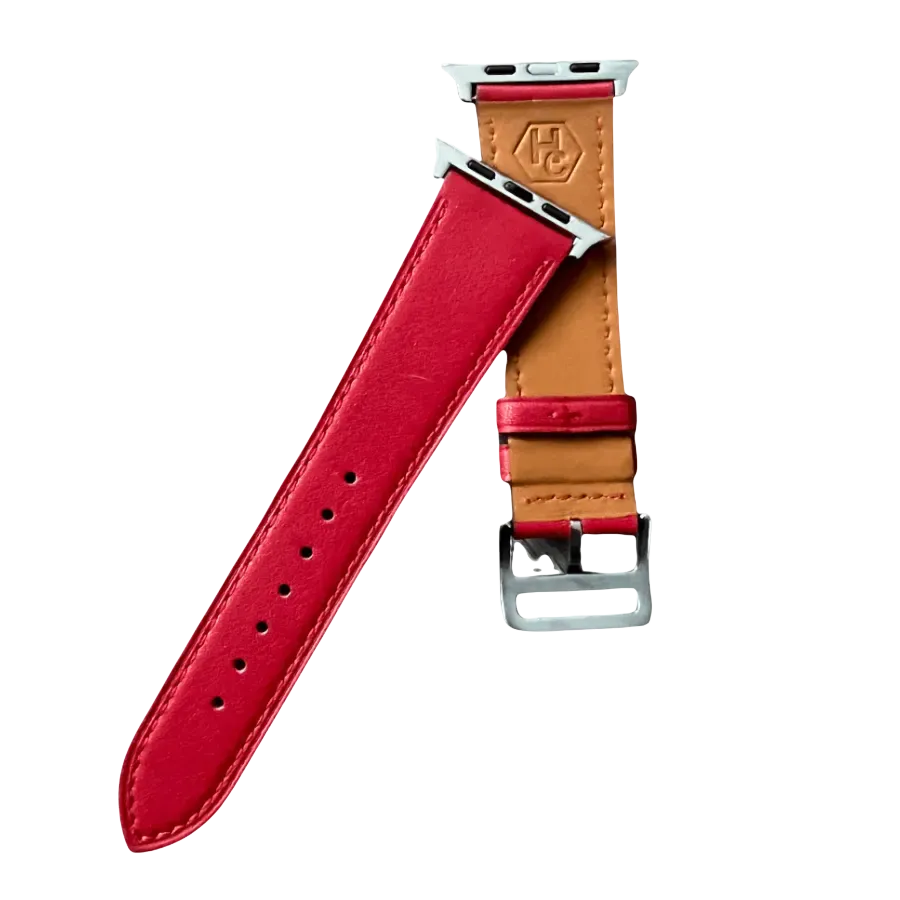 Red leather Apple Watch band, texture and buckle detail close-up