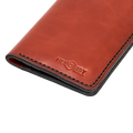 Handmade red brick leather card holder, close-up of branding detail