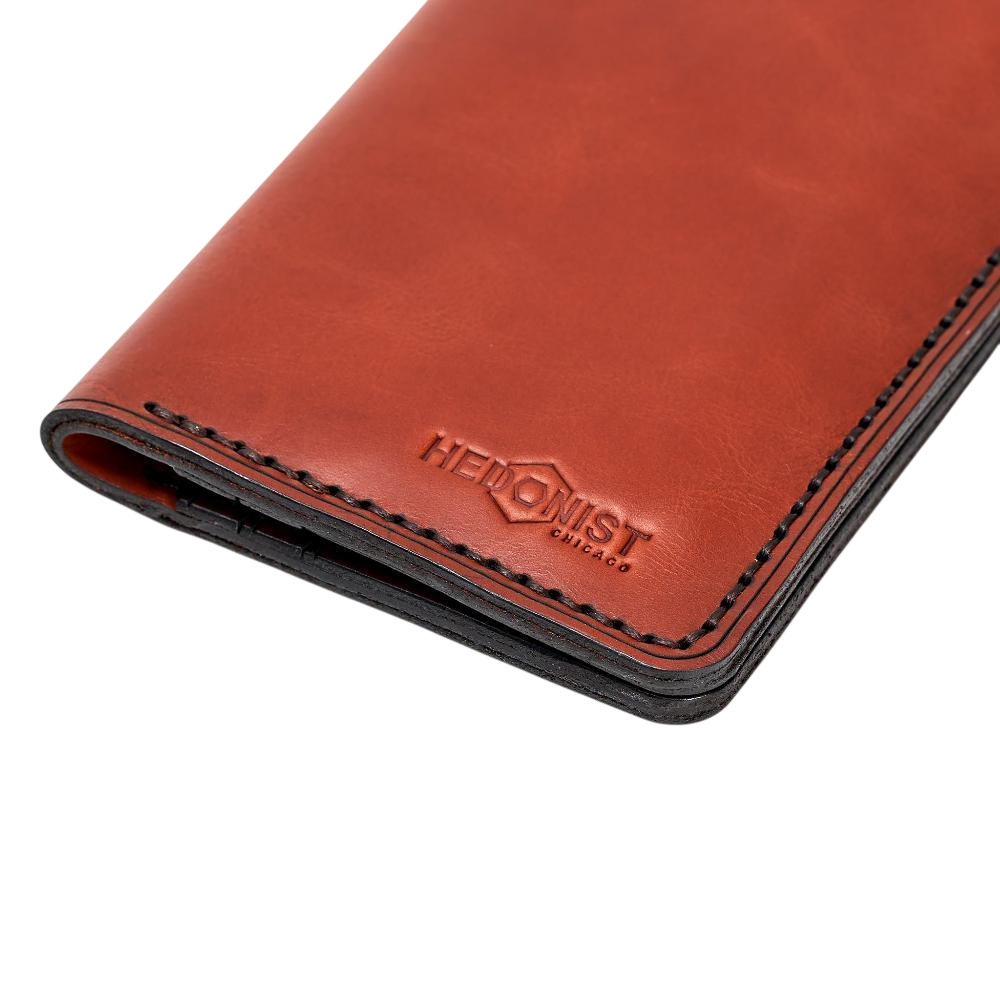 Handmade red brick leather card holder, close-up of branding detail