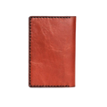 Hedonist Chicago brick passport case in brick, travel cover, full grain leather, angled view