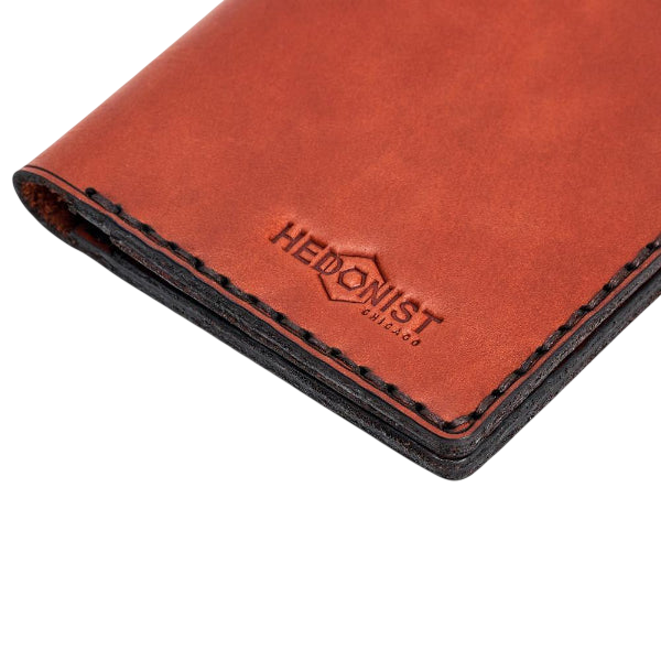 Hedonist Chicago brick passport case in brick, travel cover, full grain leather, close view
