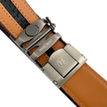 Red-brown leather ratchet belt with gunmetal rectangle buckle, hardware close-up